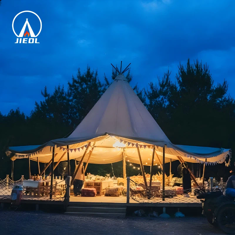 Illuminated Tipi tent with open sides at night Illuminated Tipi tent with open sides at night